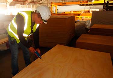 Certified Industrial Hygienist (CIH) measuring IAQ in a warehouse in Okinawa, Japan