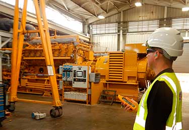 Certified Industrial Hygienist (CIH) measuring temperature exposure inside a metallic container in Okinawa, Japan
