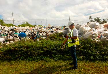 Workers at a solid waste sorting facility in Okinawa, Japan